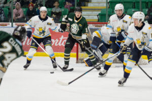 Brennen Hocher creating a screen in front of the Saints net. (Chad Goddard/Okotoks Oilers)