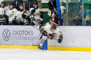 Cyle Clayton with a big hit against the Trail Smoke Eaters. (Chad Goddard/Okotoks Oilers)