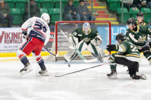 Eric Young locked in as a Bandit takes a shot on net. (Chad Goddard/Okotoks Oilers)