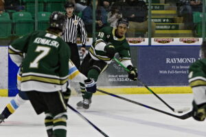 Gabe Smith looking for an open teammate. (Scott Savard/Okotoks Oilers)