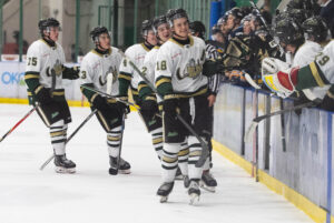 Fraser Leonard getting fist bumps after finidng the back of the net. (Chad Goddard/Okotoks Oilers)
