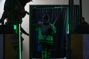 Captain Jamie Hikida making his way to the ice during player introductions. (Scott Savard/Okotoks Oilers)