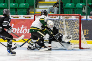 Tristin Wassengeso putting the puck past the Bulldogs netminder. (Scott Savard/Okotoks Oilers)